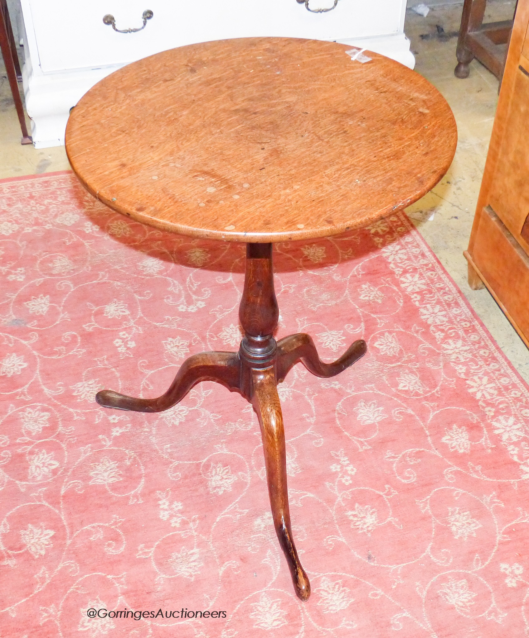 A George III oak circular topped wine table, Diam.51cm H.68cm